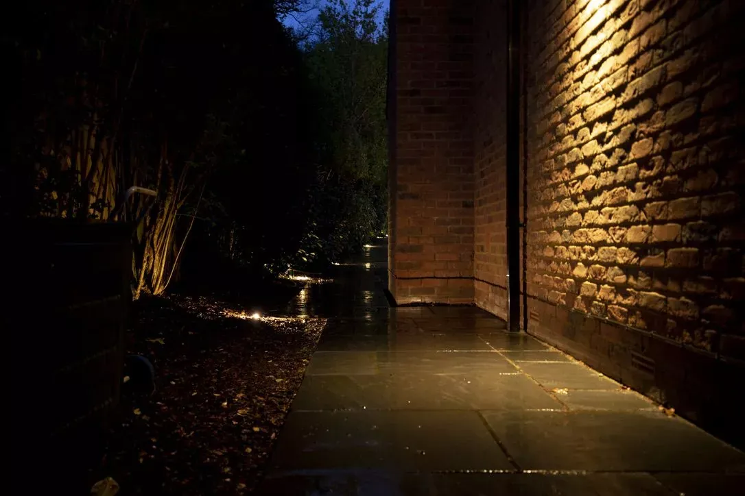 Lit garden path at night